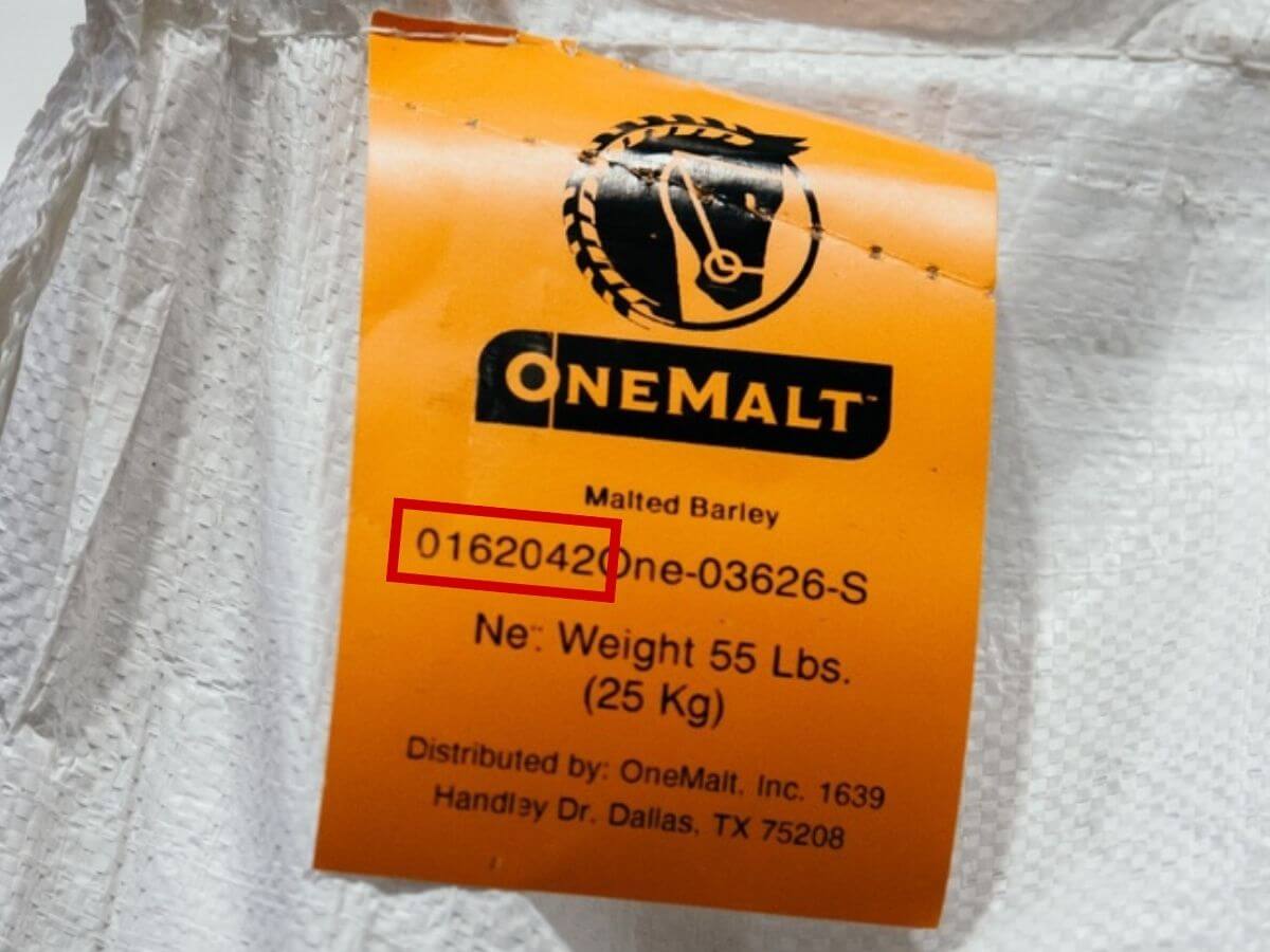 OneMalt package showing orange label and highlighting the batch/lot number on the tag